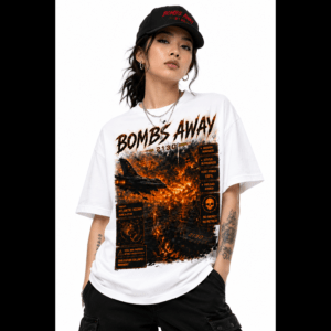 Portrait of a woman wearing a black cap and white graphic T‑shirt with orange flame design, facing the camera.