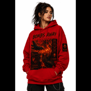 Young woman in a red graphic hoodie posing with hands in pockets against a white backdrop, showcasing bold black/orange print panels on the front.