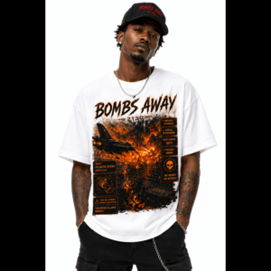 Man wearing a black cap and a large white T‑shirt with fiery orange graphics and text, facing forward.