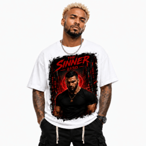 Man wearing a white graphic T-shirt with a bold red and black design featuring a dark-clad figure and the text 'The Sinner 2130'.