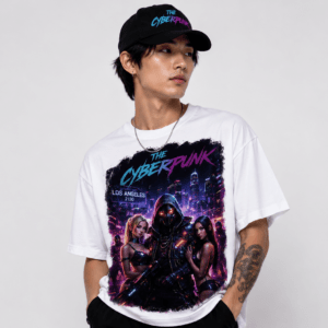 Portrait of a man wearing a white Cyberpunk graphic tee and a black cap with neon logo, posing against a light background.