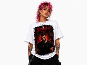 Person with bright pink spiky hair wearing a white graphic T-shirt featuring a red and black ‘The Sinner 2130’ image and a man in black.